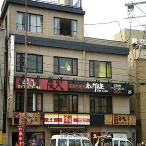 View of the building. The place is on the 3rd. floor, so take the stairs left to Sukiya. at Cafe Proverbs 15:17 in Kyoto