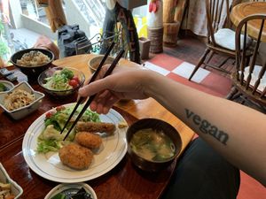 Potato crocketts and my tattoo.  at Alicia in Tokyo