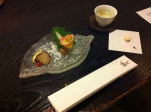 Amuse bouche. Broth, mushroom and some type of sugar pill. at Fucha Bon in Tokyo