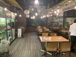 Entrance and outdoor seating at Crayon House in Tokyo