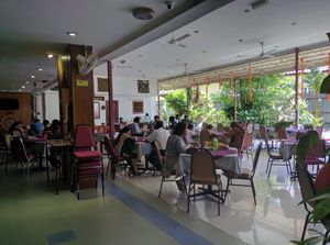 The spacious al-fresco dining area by the garden at Annalakshmi Temple of Fine Arts in Penang