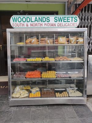 Sweets sold outside of the shop at Woodlands Vegetarian Restaurant - Georgetown in Penang