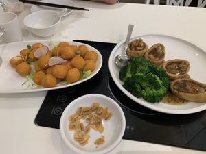 The things on the right were delicious!! Can’t remember what they were  at  Ling Zhi Restaurant 灵芝 - Novena in Central Singapore