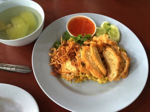 A vegetarian chicken (tofu) dish with yellow rice and soup, 25 baht at Chamlong's / The Vegetarian Society Chatuchak in Bangkok