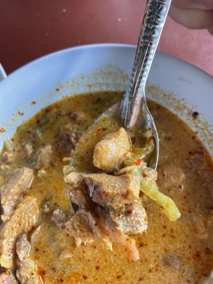 Close-up beef in Khao Soi  at Chamlong's / The Vegetarian Society Chatuchak in Bangkok