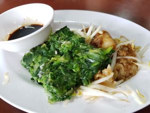 Veggie pattie and fried diced carrot cakes in sweet sauce at Chamlong's / The Vegetarian Society Chatuchak in Bangkok