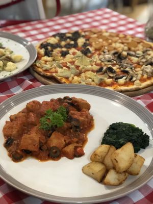 Delicious vegan pizza and vegan meat in tomato sauce at Govinda Italian Restaurant & Pizzeria in Bangkok