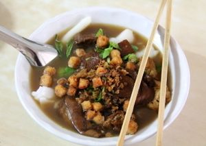 Cheap noodle soup. Just point the brown tofu broth next to the glass counter to show that you want this soup.  at Kaodaeng - Kaeng Rawn in Bangkok