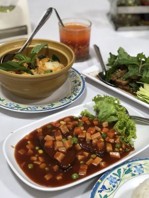 Vegan ham and fish in spicy sauce, vegan seafood curry, vegan nam tok salad at Ruyi Vegetarian in Bangkok