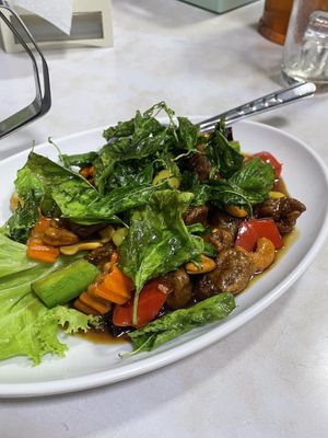 Chicken with cashew, topped with fried basil leaves   at Ruyi Vegetarian in Bangkok