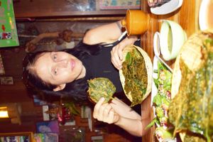 With their signature dish, crispy deep fried leaves! at Aum in Chiang Mai