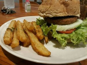 Veggie burger with fries  at Aum in Chiang Mai