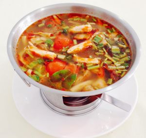 Tom yum crab hot pot
with crabmeat made of konjac roots and mushrooms
 at Five Star J Restaurant in Pattaya
