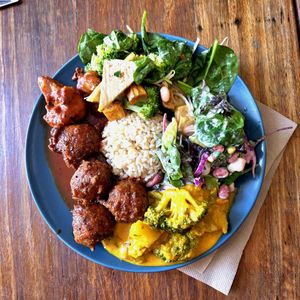 Medium vegan bowl: kofta with sauce, battered cauliflower, 3different salads, curry & brown rice at Cardamom Pod in Byron Bay