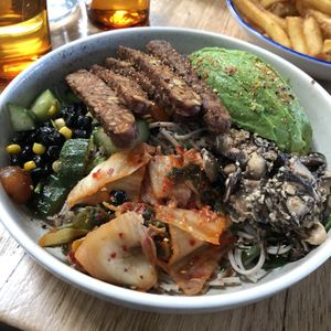 Zen Buddha Bowl. $26 Soba noodles, red quinoa, yuzu salad, marinated 3 seed tempeh, miso shitake mushrooms, avocado, black bean, corn, salsa, kimchi, spinach, pickled ginger at Vegie Bar in Fitzroy