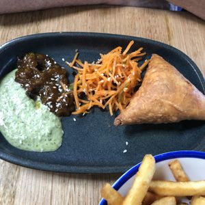 traditional Indian pastry filled with mild vegetable curry, served with a refreshing Bombay carrot salad, tamarind chutney & coriander chilli coconut yoghurt. (1 per serve). $9.50 at Vegie Bar in Fitzroy