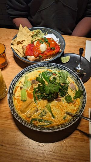 Laksa which is solid and worst the price, and in the background is the burito/enchilada thing - which was very eh. at Vegie Bar in Fitzroy