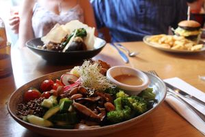 BUDDHA BOWL 

A bed of quinoa with organic 3 seeds tempeh, sprouts, broccoli, shiitake mushrooms, sauerkraut, cherry tomatoes, cucumber, radish, spinach, activated almonds and a miso dressing. at Vegie Bar in Fitzroy
