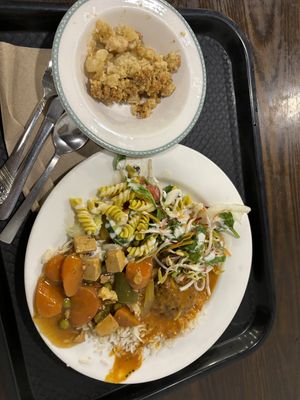 A mix of curries, salad and rice with a dessert of apple crumble and a drink all for $12.50  at Gopals in Melbourne