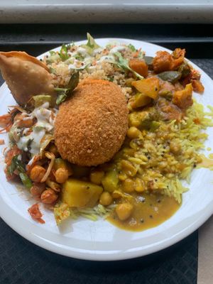 Not so hungry plate ( peanut butter curry, Indian curry) with quinoa and chickpea salad. Added a samosa and kidney bean croquette. Indian curry bland. PB curry just tastes hot at Gopals in Melbourne