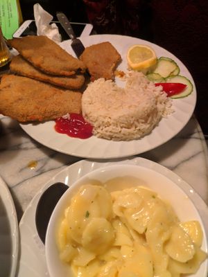 wiener schnitzel with rice and potato salad at Rupp's Vegetarisches Pub   in Vienna