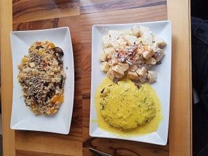 basmati risotto, vegan pepper steak, potato salad at Bio Bar von Antun in Vienna