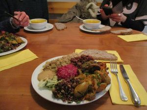 Chili, sautéed mushrooms, potatoes, sweet potatoes, whole-grain rice, red rice, quinoa, cabbage, beetroot hummus, bread at Dolma in Brussels