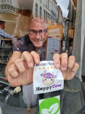 Gave a Happy Cow decal to founder Paul Florizoone, which was immediately put up! at Greenway in Ghent