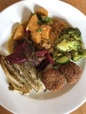 Quinoa, squash curry, bean croquettes, grilled endive and beetroot and greens.  at Lekker GEC in Ghent