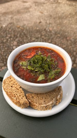 Soup with fresh herbs and bread  at Morgenstedet in Copenhagen