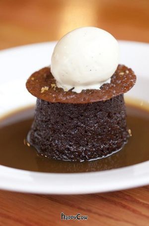 Sticky toffee pudding with butterscotch sauce and vanilla ice cream at Food For Friends in Brighton