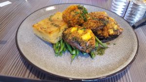 Black garlic purée, potato millefeuille, beans ans vegan cheese stuffed mushrooms. Excellent ! at Food For Friends in Brighton