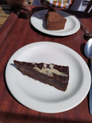 Raw chocolate cake and cheesecake at Infinity Foods Kitchen in Brighton