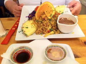 Gado Gado-
Crispy julienne of exotic & seasonal vegetables Indonesian style, with turmeric, brown rice, garnished with pineapple, orange & physalis. Served with sides of peanut sauce,plum sauce & Tamari soy. at Rainbow Vegetarian Cafe in Cambridge