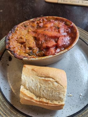 Spicy chickpea casserole (right) with coconut spinach dahl at The Good Earth in Leicester