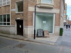 Sign on way to the Good Earth (walking towards Charles Street) at The Good Earth in Leicester