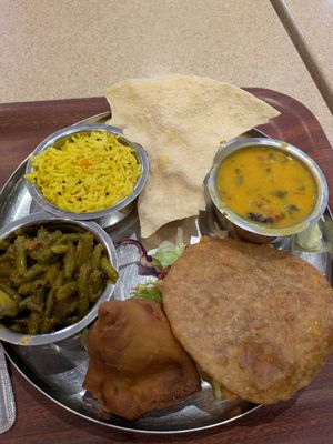 Vegan platter with samosa and puri at Govinda's in London