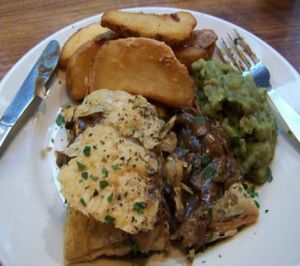 mixed mushroom, porcini, and ale pie served with fries and mushy peas at Mildreds - Soho in London