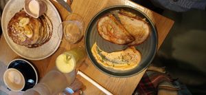 Kimchi toastie, banana butterscotch pancakes, fresh juice and hot chocolate at Mildreds - Soho in London