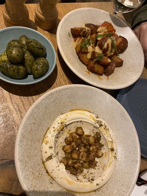 Patatas Bravas, Olives and Hummus (Be aware you have to pay extra for bread to go with hummus)   at Mildreds - Soho in London