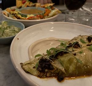 Chorizo Nachos plus Tomatillo Guacamole alongside Hot and Sour Cabbage  at Mildreds - Soho in London