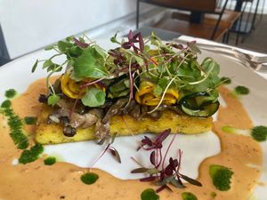 Chipotle Wild Mushrooms—sautéed with shallots and thyme in creamy chipotle sauce, served with polenta cake and grilled courgette ribbons at The Gate - Hammersmith in West London