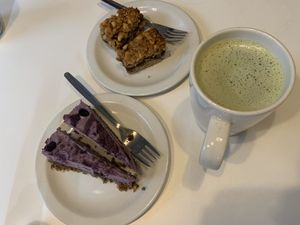 Raw blueberry cheesecake, oat date dessert and matcha latte   at Earth Cafe in Manchester