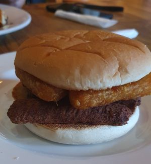 Vegan sausage and has brown toasted bap at Fuel in Manchester