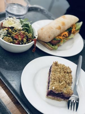 Salad, banh mi, and mixed berry crumble  at The 8th Day in Manchester