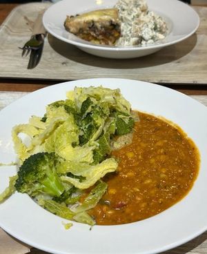 Dahl rice & greens, moussaka and potato salad at The 8th Day in Manchester