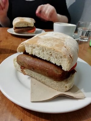 Vegan sausage sandwich at The 8th Day in Manchester