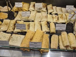 Shop's deli counter at The 8th Day in Manchester