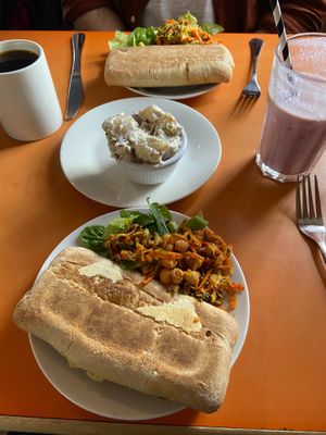 Vegan salami, cheese and pesto panini with chickpea relish and potato salad 💚 at The Egg Cafe in Liverpool