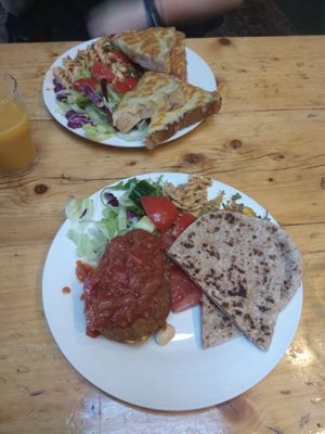 Vegan bean burger with a tomato sauce, pitas and salads at The Egg Cafe in Liverpool